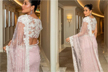Kareena Kapoor in a blush pink saree walks the festive path on a hot day